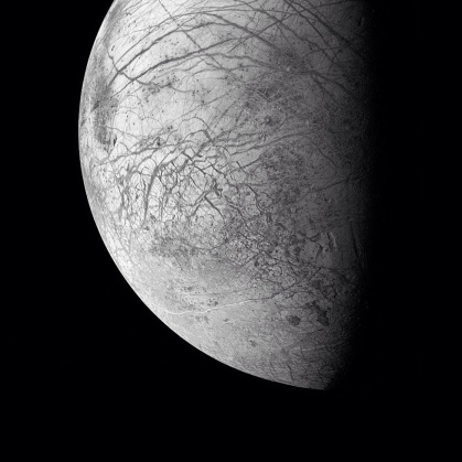 Europa - one of Jupiter's dozens moons - has a an icy surface filled with sprawling faults and deep flowing ridges.